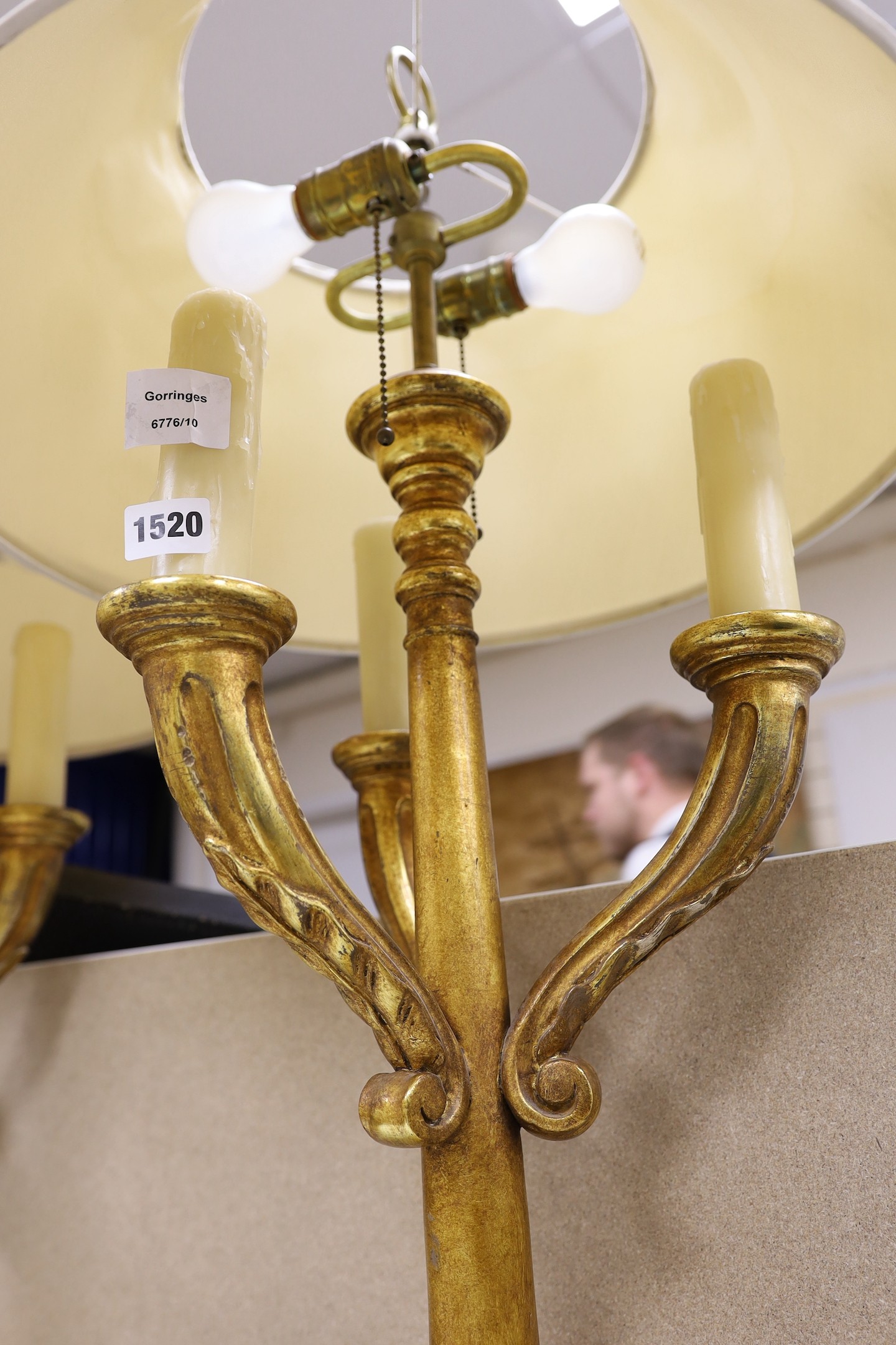 A pair of giltwood three branch lamps, 76 cms high